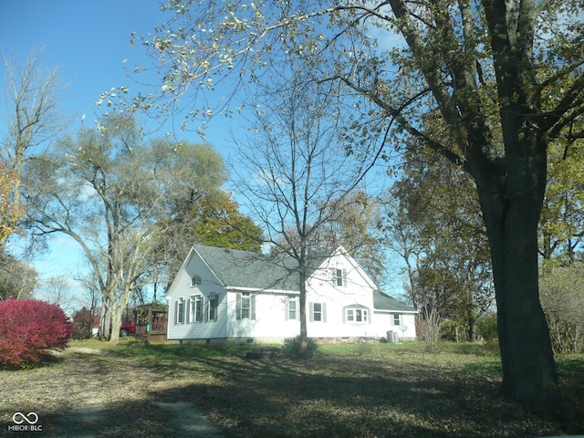 view of side of home featuring a lawn