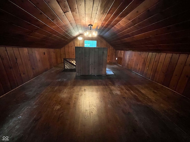 bonus room with lofted ceiling, dark hardwood / wood-style floors, wooden walls, and wooden ceiling