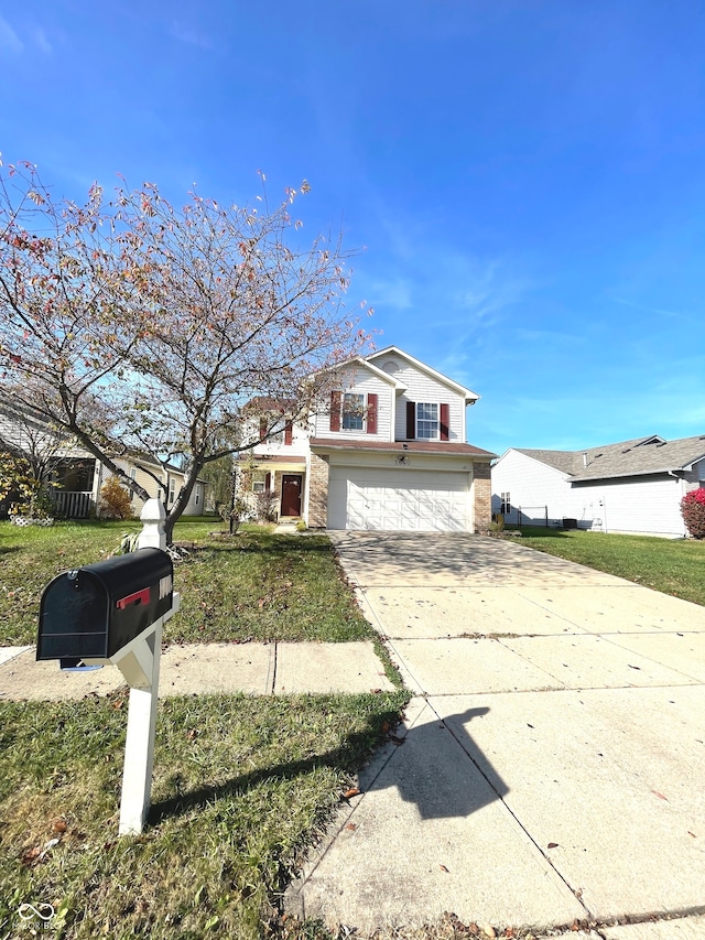 view of front of property with a garage and a front lawn