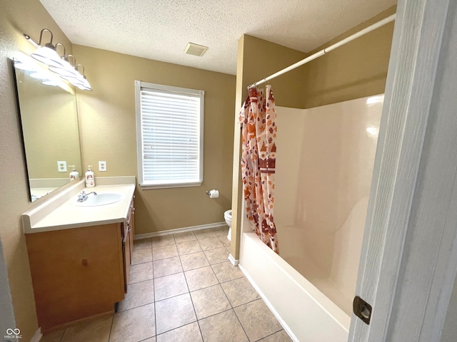 full bathroom with a textured ceiling, toilet, shower / bath combo, vanity, and tile patterned floors