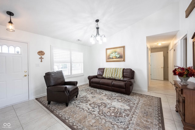 living room featuring light tile patterned floors, vaulted ceiling, and a notable chandelier