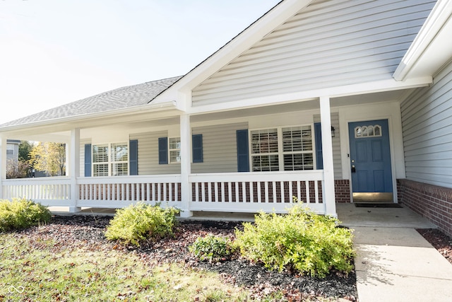 property entrance featuring covered porch