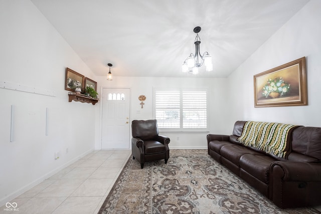 living room featuring lofted ceiling, a chandelier, and light tile patterned flooring