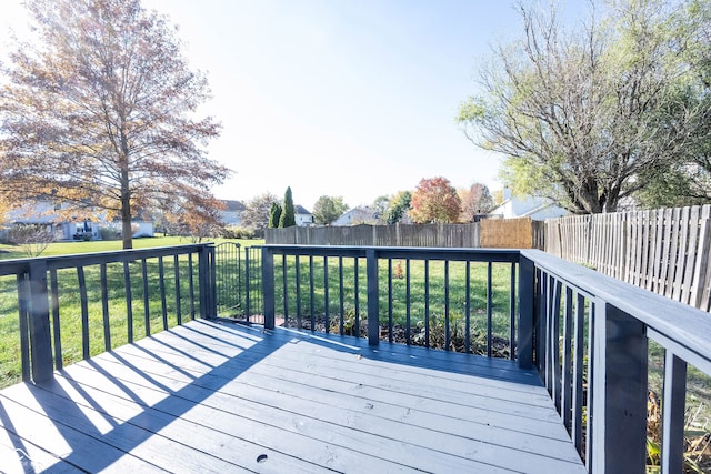 wooden deck with a lawn