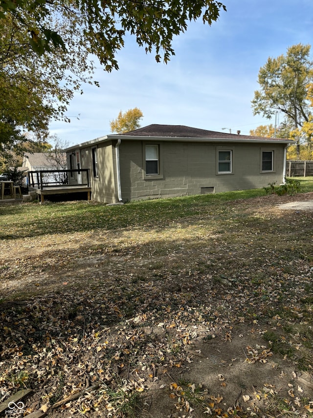 view of property exterior featuring a wooden deck