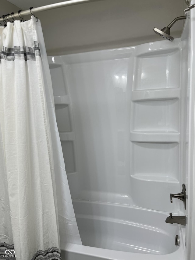 bathroom featuring shower / bath combo with shower curtain