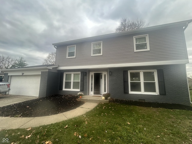 front of property with a front lawn and a garage