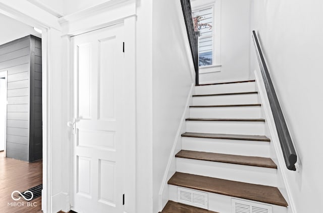 staircase featuring hardwood / wood-style floors