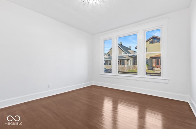 empty room with hardwood / wood-style floors