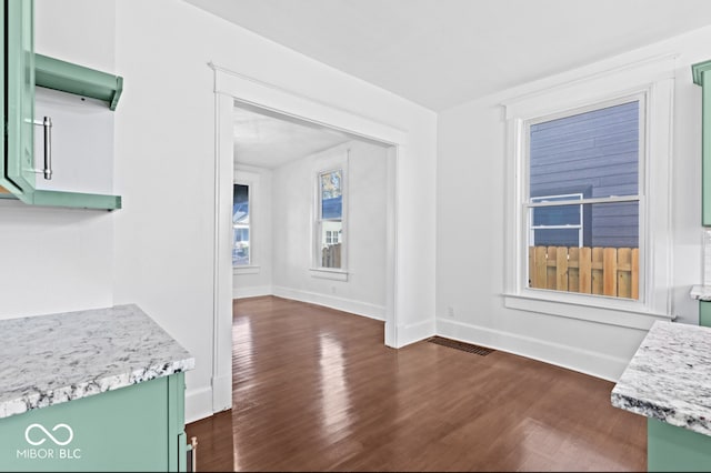 interior space with dark hardwood / wood-style flooring