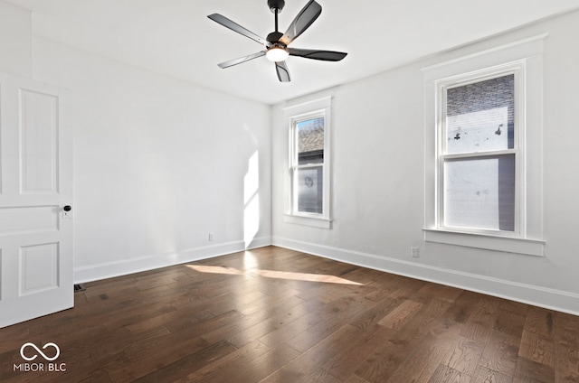 unfurnished room featuring ceiling fan, dark hardwood / wood-style flooring, and plenty of natural light