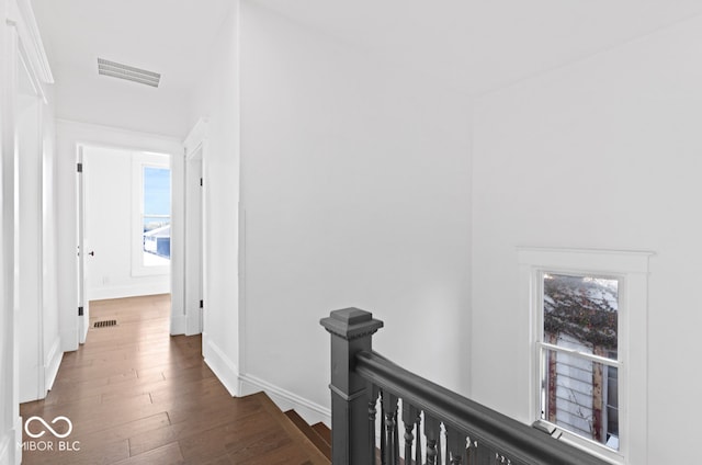 corridor featuring dark hardwood / wood-style flooring