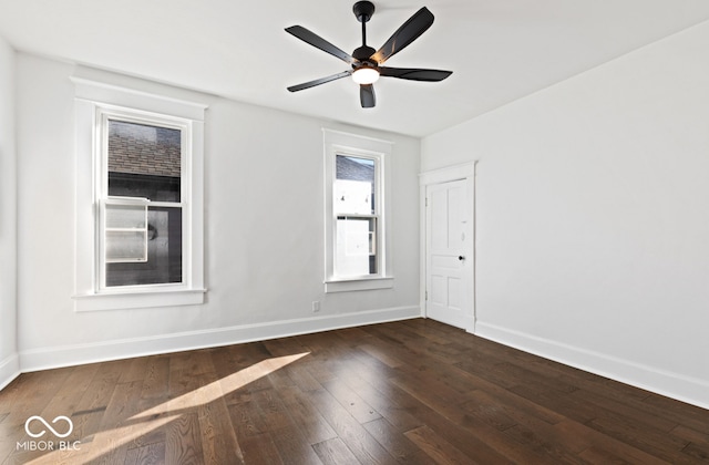 unfurnished room with dark hardwood / wood-style floors and ceiling fan