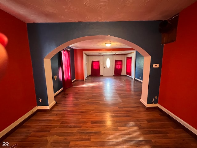 hall featuring dark wood-type flooring