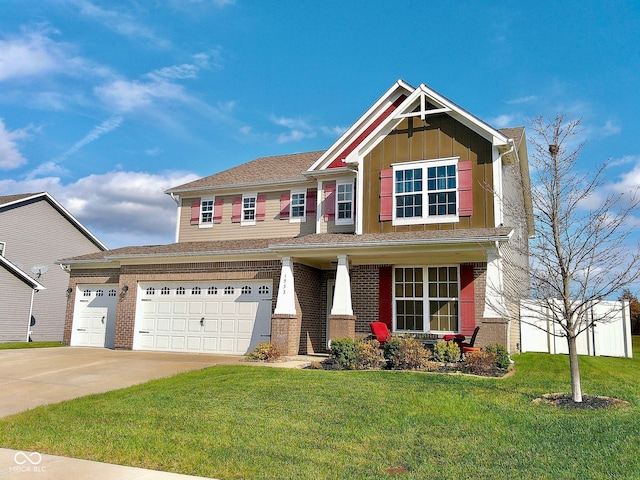 craftsman house with a garage and a front yard