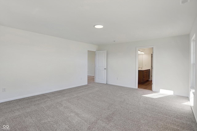 spare room with light carpet