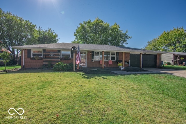 ranch-style house featuring a front yard and a garage