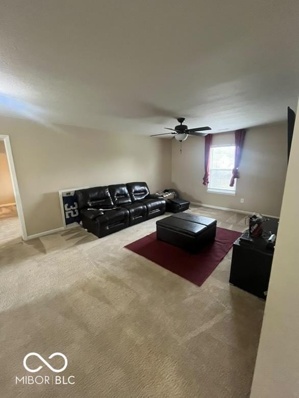 unfurnished living room with carpet flooring and ceiling fan