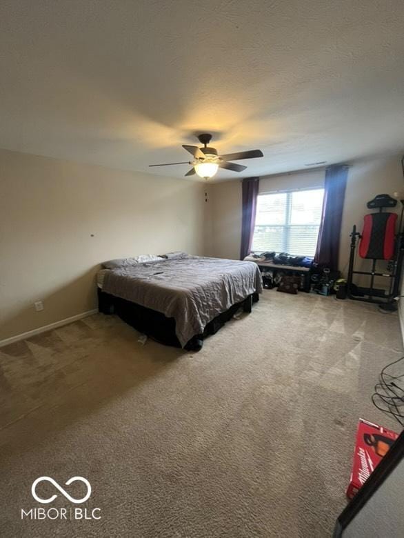 bedroom featuring ceiling fan, carpet floors, and pool table