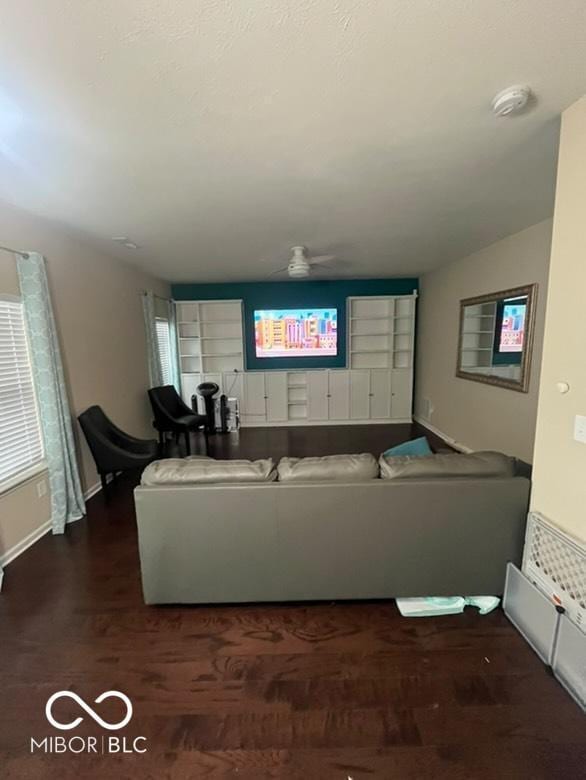 unfurnished living room featuring dark hardwood / wood-style floors