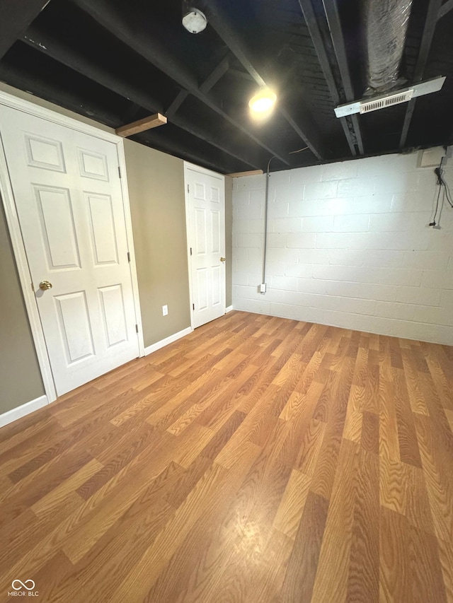 basement featuring light hardwood / wood-style floors