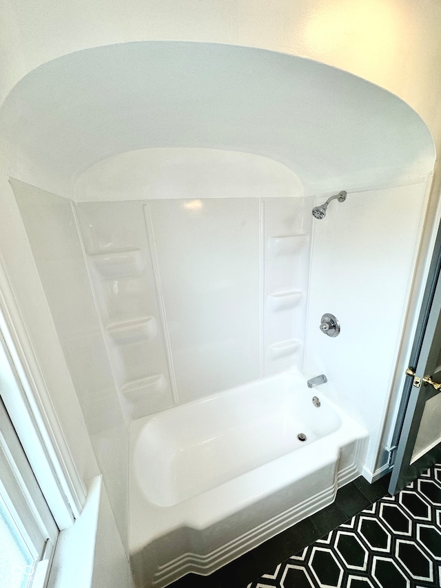 bathroom featuring washtub / shower combination