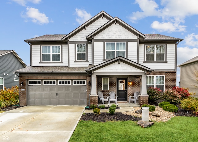 craftsman inspired home with a porch and a garage