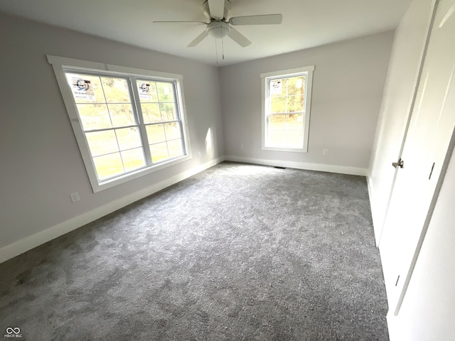 carpeted empty room with ceiling fan