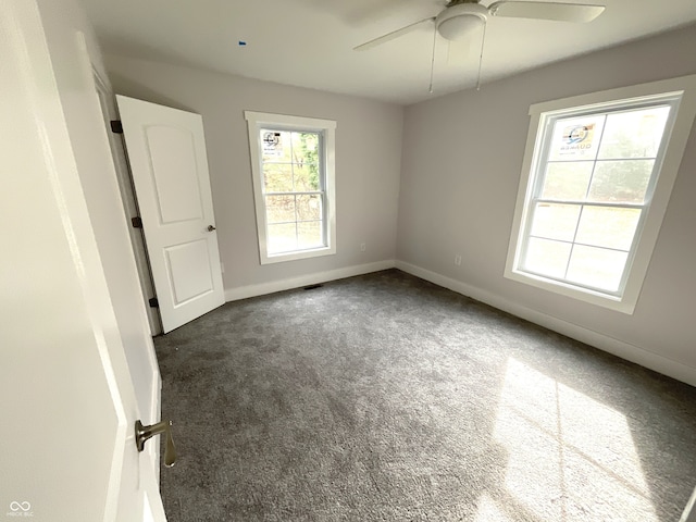 carpeted empty room with ceiling fan