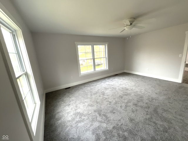 carpeted empty room with ceiling fan