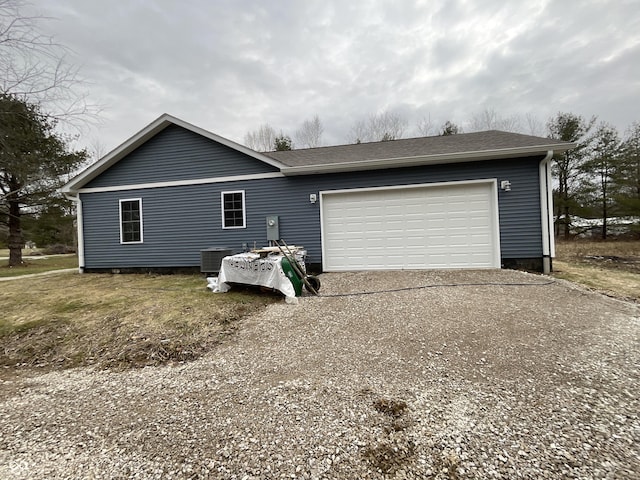 exterior space featuring a garage and central air condition unit