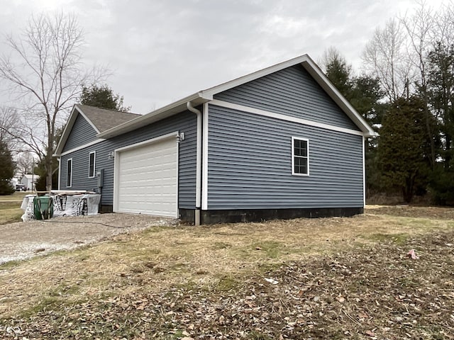 view of property exterior with a garage