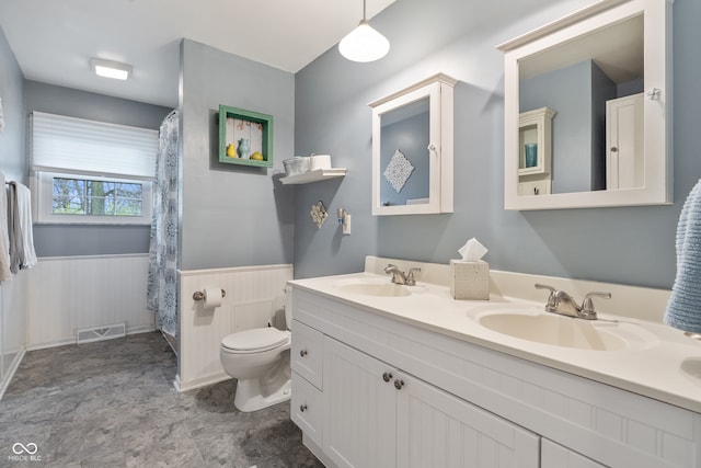 bathroom with vanity and toilet