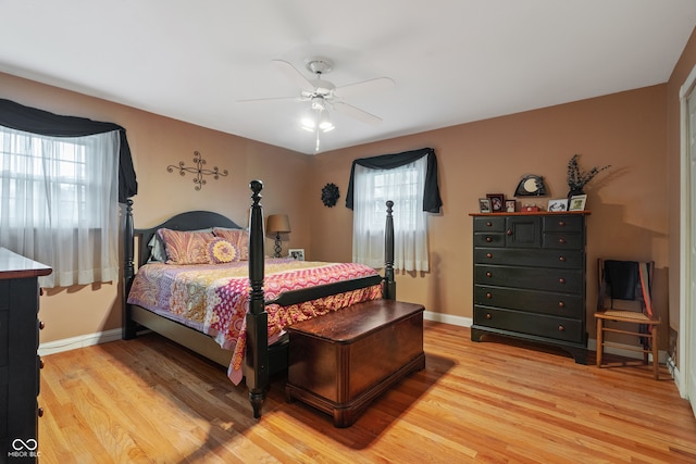 bedroom featuring ceiling fan and light hardwood / wood-style flooring