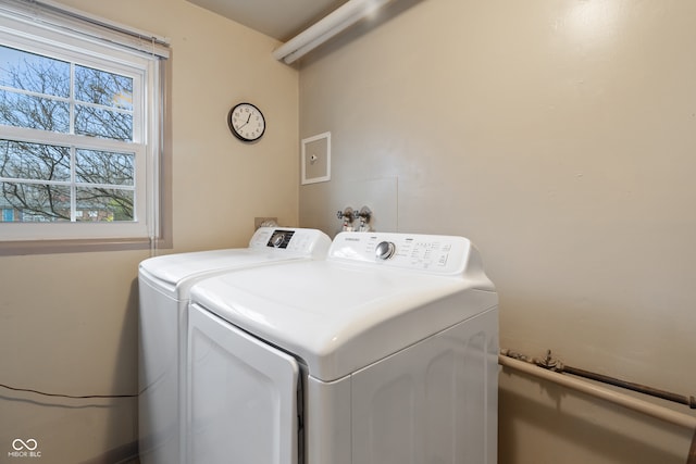 washroom with washing machine and clothes dryer