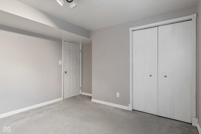 unfurnished bedroom featuring light carpet