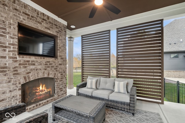 interior space featuring an outdoor brick fireplace and ceiling fan