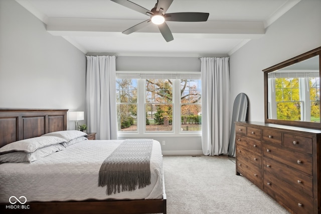 carpeted bedroom featuring beam ceiling, multiple windows, ceiling fan, and crown molding