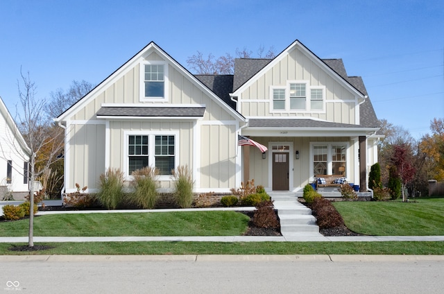 view of front facade featuring a front lawn and covered porch