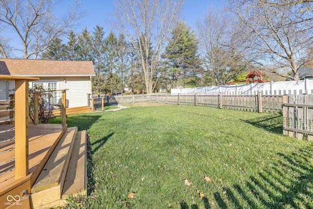 view of yard with a wooden deck