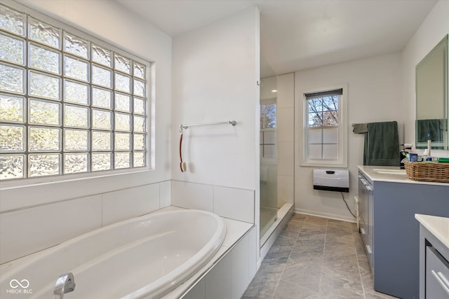 bathroom featuring independent shower and bath and vanity