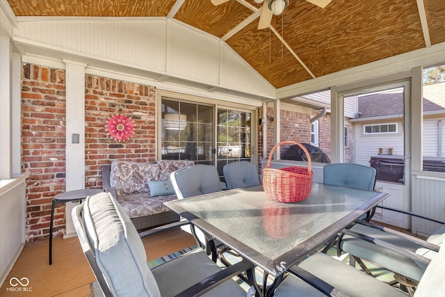 interior space featuring a wealth of natural light, ceiling fan, wood ceiling, and lofted ceiling