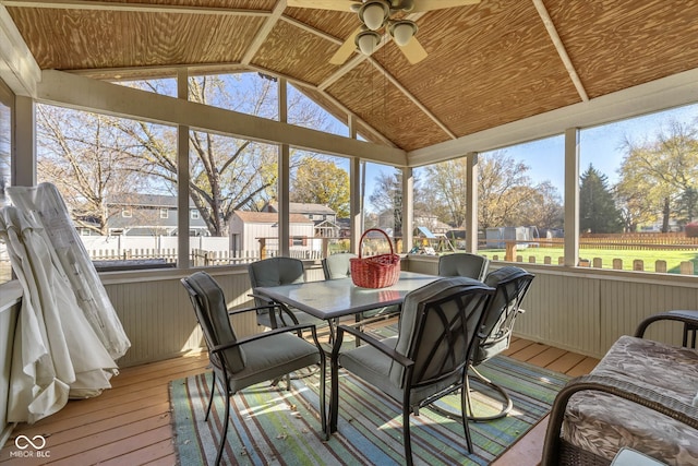 sunroom with a healthy amount of sunlight, ceiling fan, and vaulted ceiling