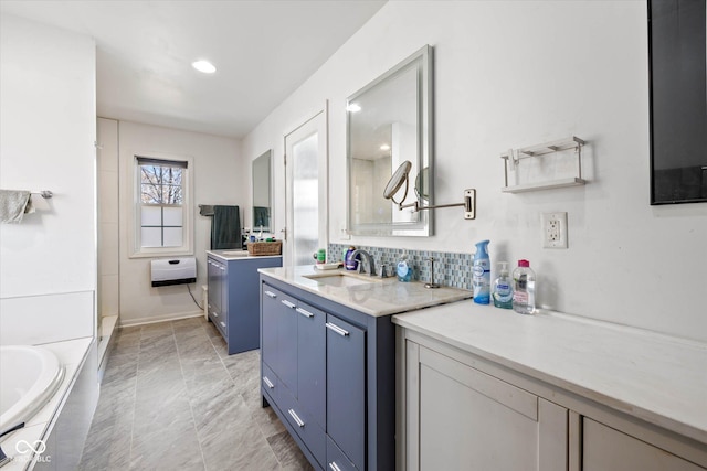 595 Hawthorne Dr, Carmel, IN 46033 - bathroom with two vanities, a tub to relax in, marble finish flooring, a shower, and decorative backsplash