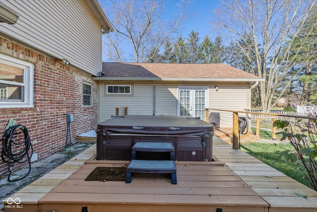 wooden deck featuring a hot tub