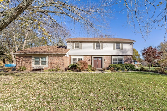 595 Hawthorne Dr, Carmel, IN 46033 - colonial-style house featuring brick siding and a front yard