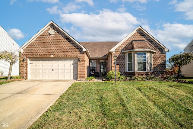 view of front of home with a garage and a front yard