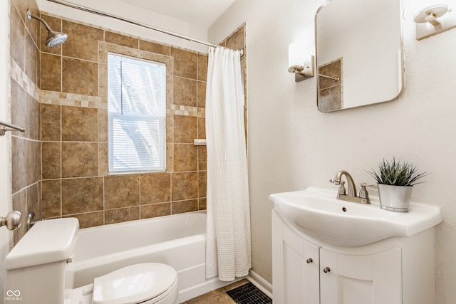 full bathroom featuring shower / bath combination with curtain, vanity, and toilet