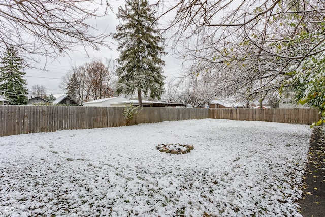 view of yard covered in snow