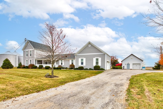 view of front facade featuring a front lawn and a garage